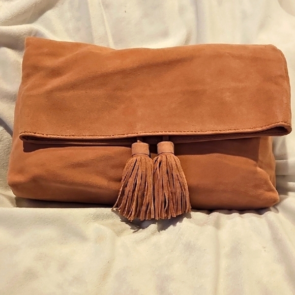 Ann Taylor Handbags - Ann Taylor chic soft pink suede clutch with tassels like new condition